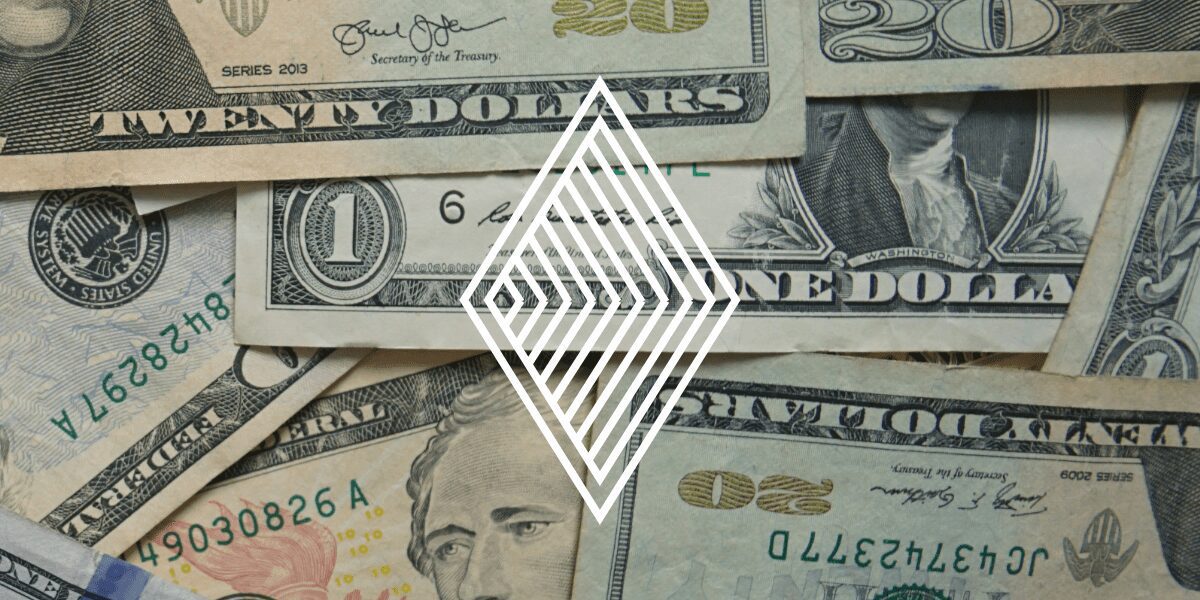 US dollar bills scattered with a diamond graphic overlay, symbolizing the value of robust Anti-Money Laundering programs in protecting financial integrity.