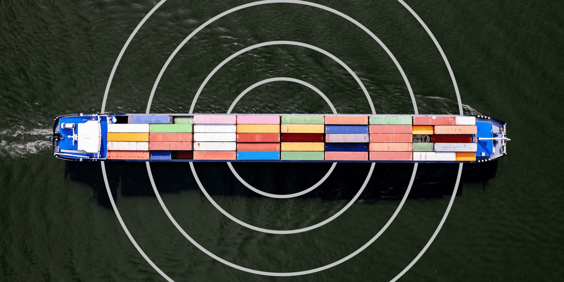 Ship carrying colorful cargo, signaling the international nature of modern business and the importance of supply chain protections.
