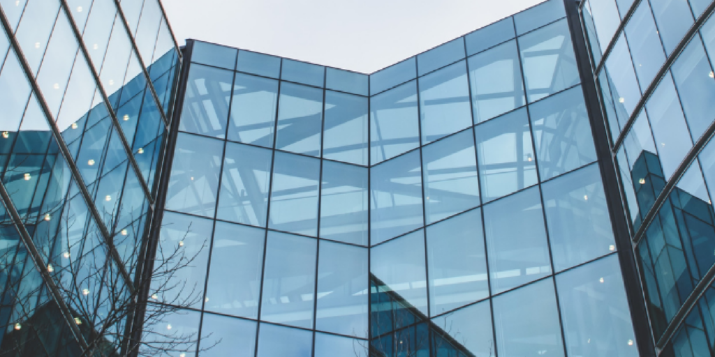 Buildings clustered together symbolizing delicate business relationships.