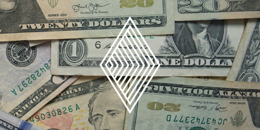 US dollar bills scattered with a diamond graphic overlay, symbolizing the value of robust Anti-Money Laundering programs in protecting financial integrity.