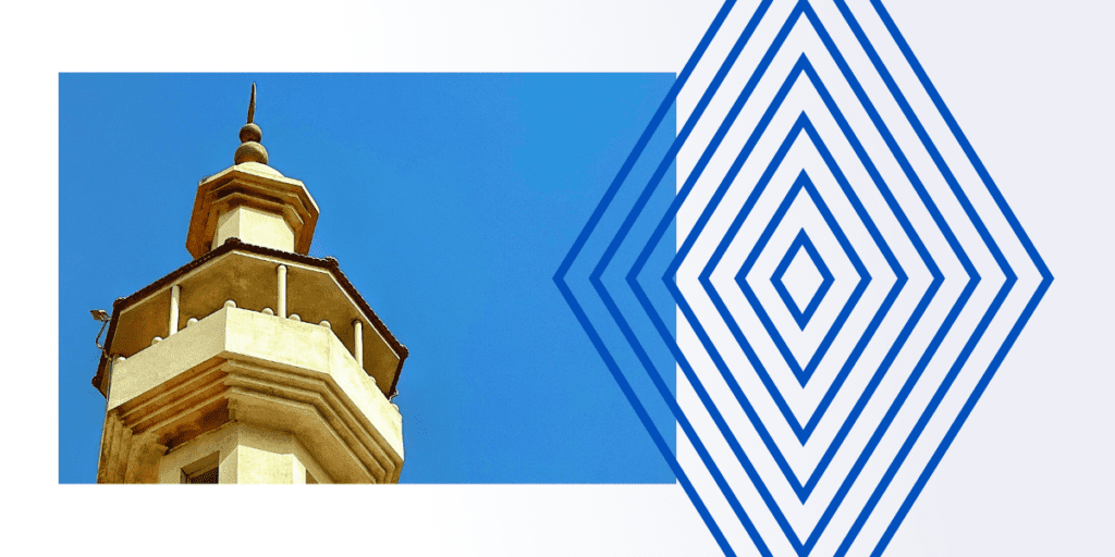 Top of a yellow building set against the sky, symbolizing the elevated insights and informational advantages that investors seek for strategic due diligence decision-making.
