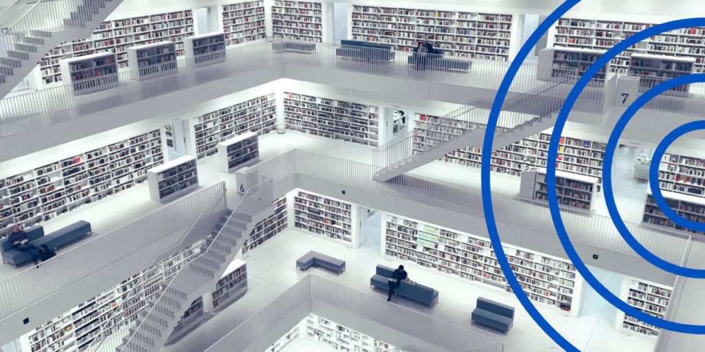 Multi-floor library with rows of bookshelves and open balconies, symbolizing vast data storage and access similar to data aggregators.