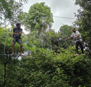 Vcheck's India team enjoying a ropes course.