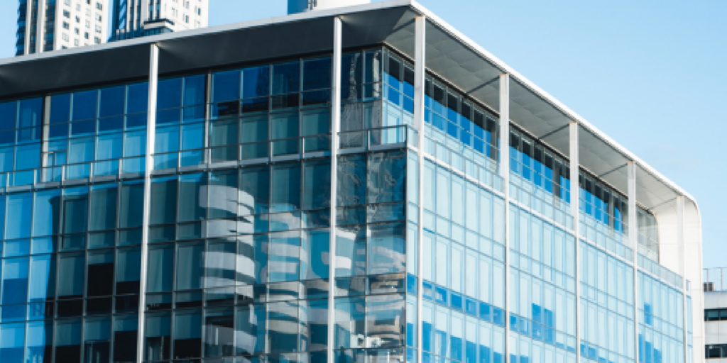 Buildings clustered together symbolizing delicate business relationships.