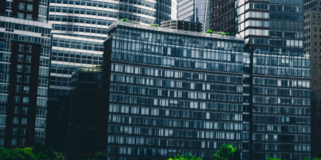 Buildings clustered together symbolizing delicate business relationships.