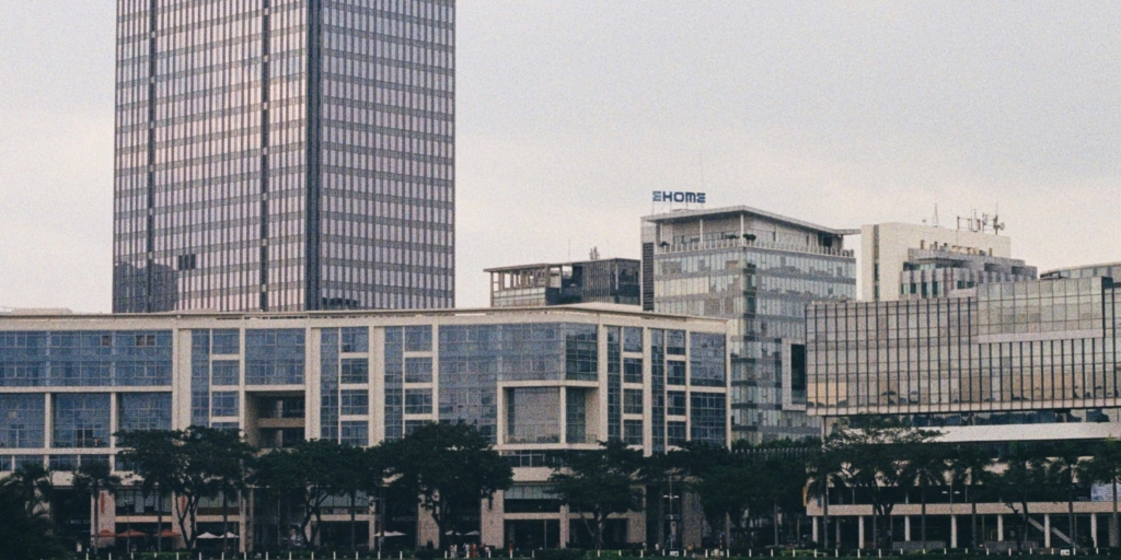 Buildings clustered together symbolizing delicate business relationships.