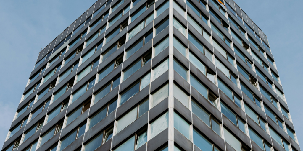 Buildings clustered together symbolizing delicate business relationships.