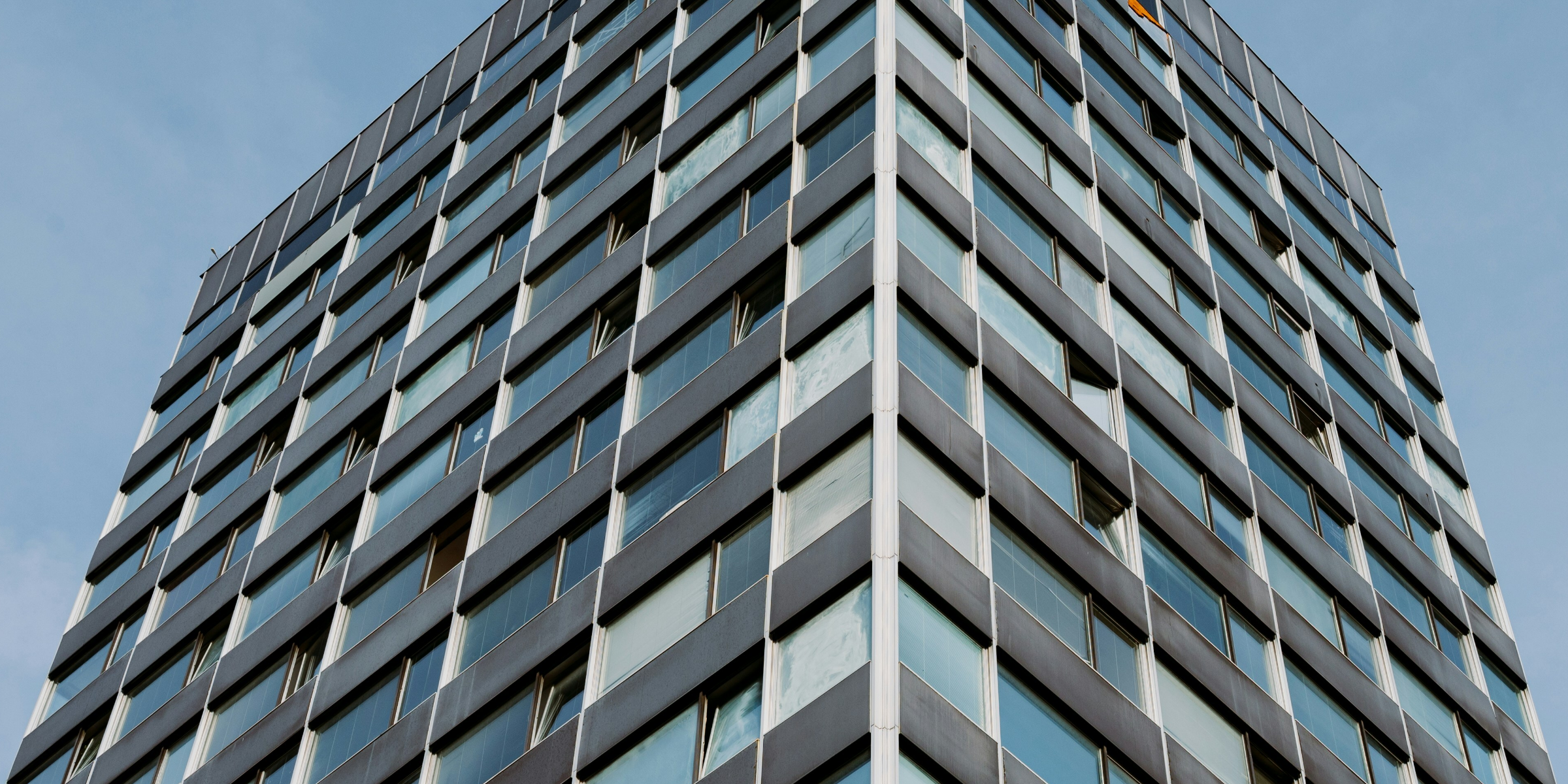 Buildings clustered together symbolizing delicate business relationships.