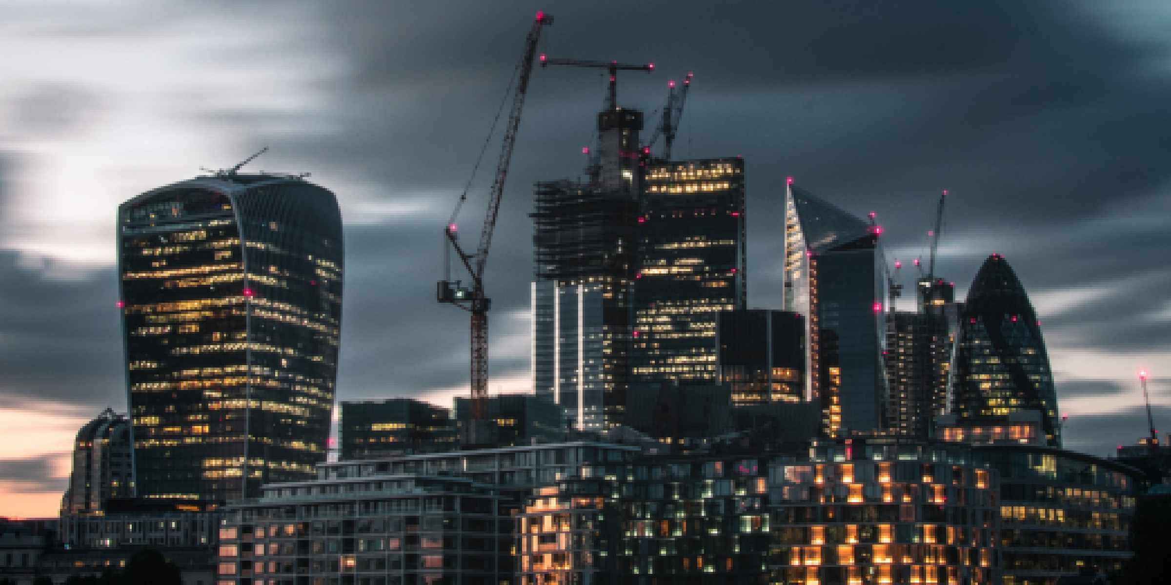 Buildings clustered together symbolizing delicate business relationships.